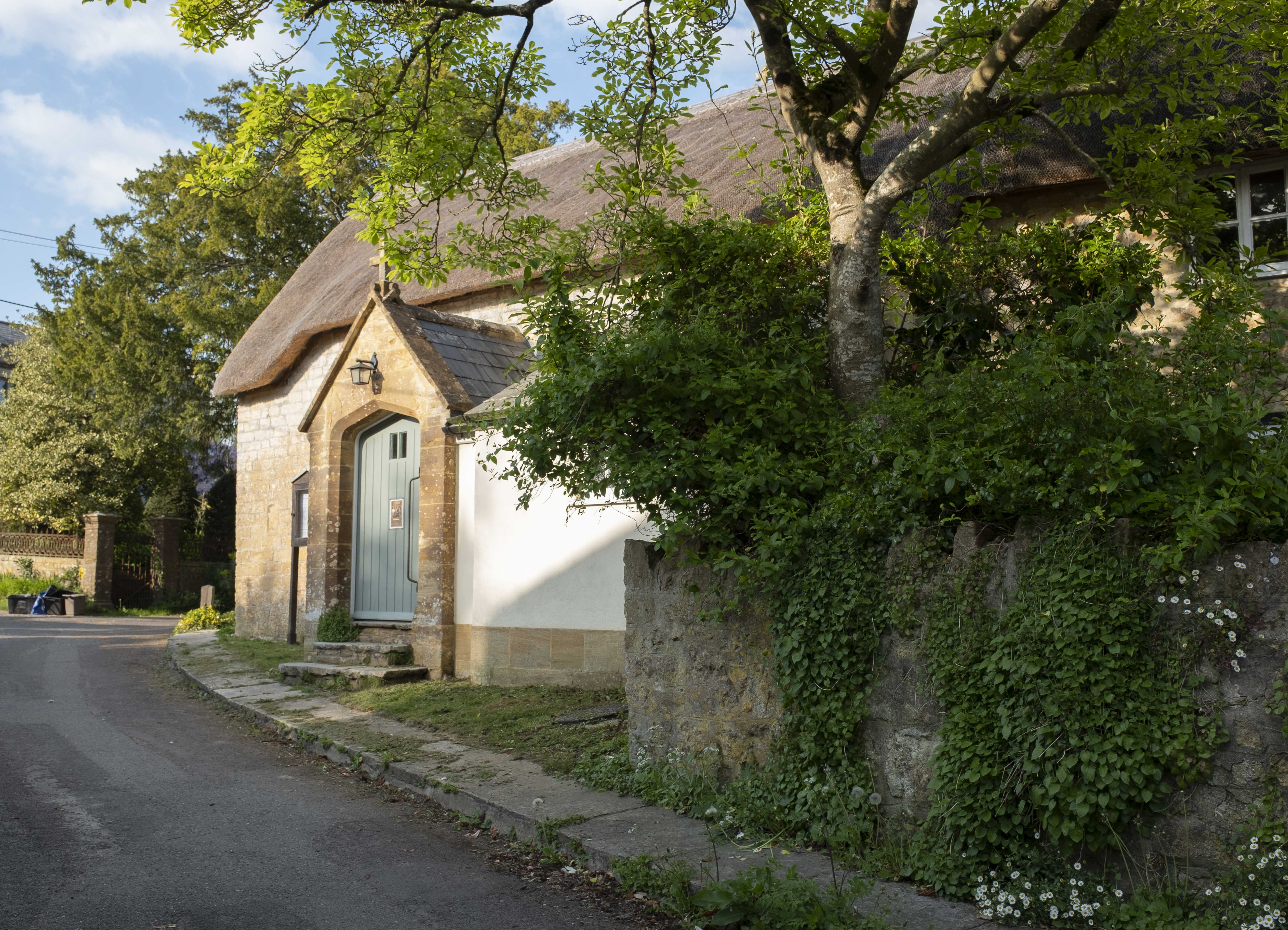 Thatched house with green door